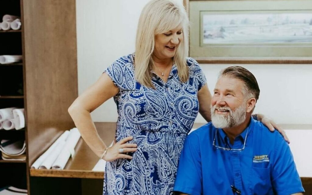 Tonya and Todd Reed sharing a moment at Henry Plumbing in Savannah GA office