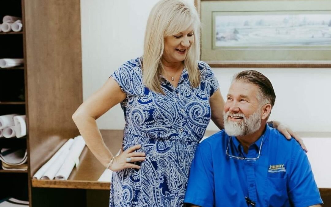Tonya and Todd Reed sharing a moment at Henry Plumbing in Savannah GA office