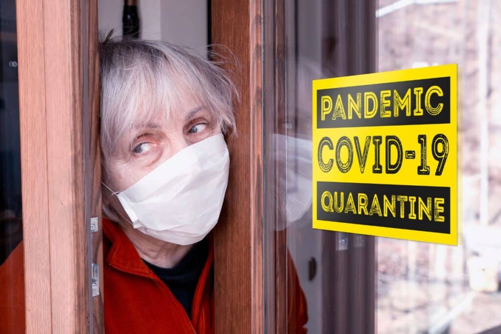 Woman wearing mask during COVID-19 quarantine at home