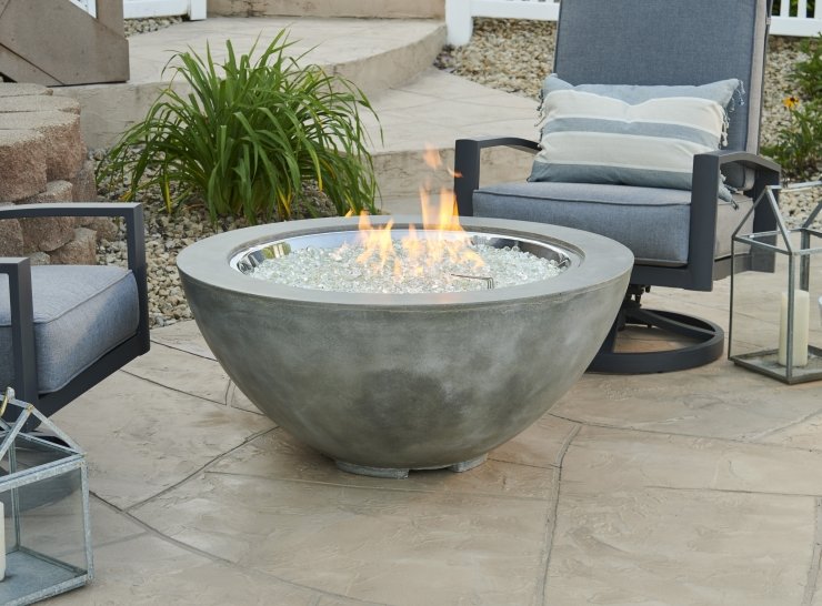 Decorative outdoor fireplace installation and plumbing feature