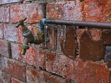 Rusted and frozen plumbing pipes requiring replacement and plumbing repair