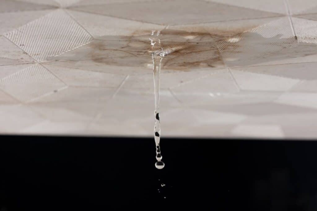 Ceiling water leak and plumbing damage requiring repair services