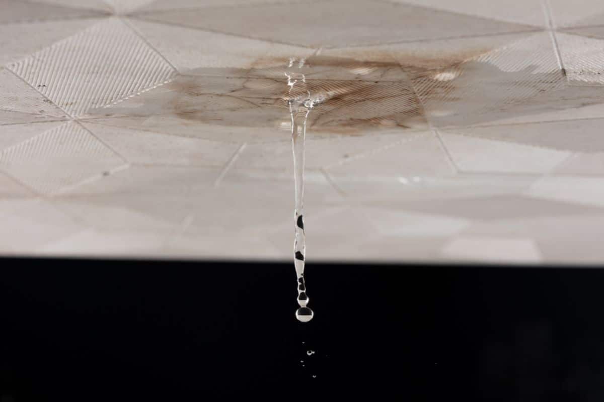Ceiling water leak and plumbing damage requiring repair services