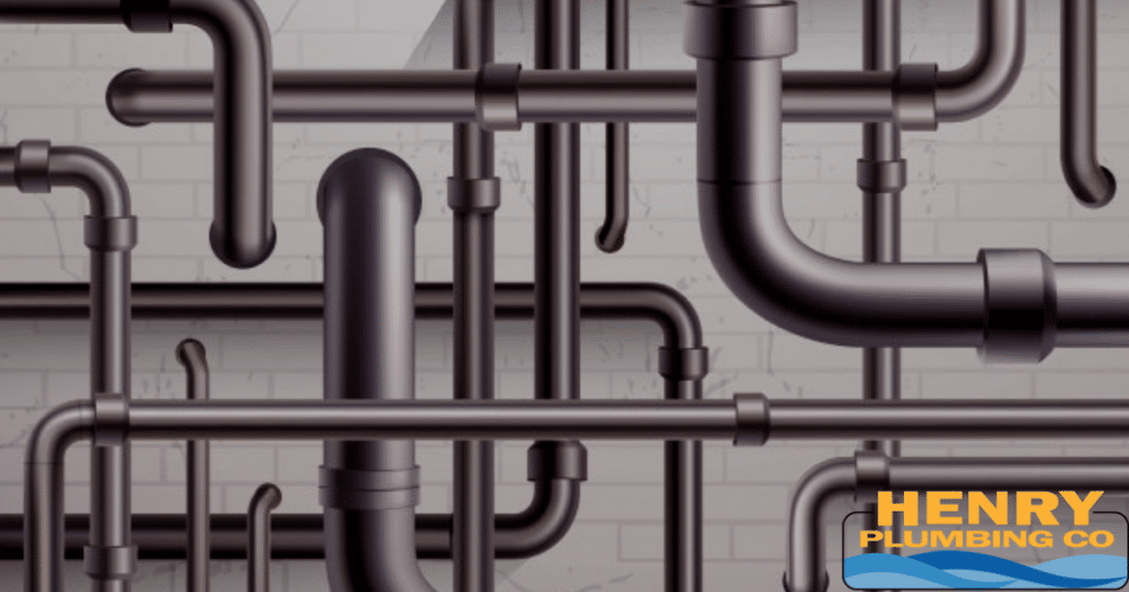 Exposed PVC plumbing pipes installed inside a framed wall, showing part of a residential drain and vent system during construction or renovation.
