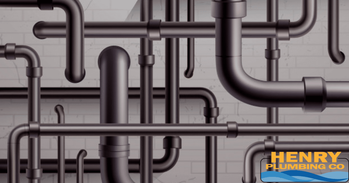 Exposed PVC plumbing pipes installed inside a framed wall, showing part of a residential drain and vent system during construction or renovation.