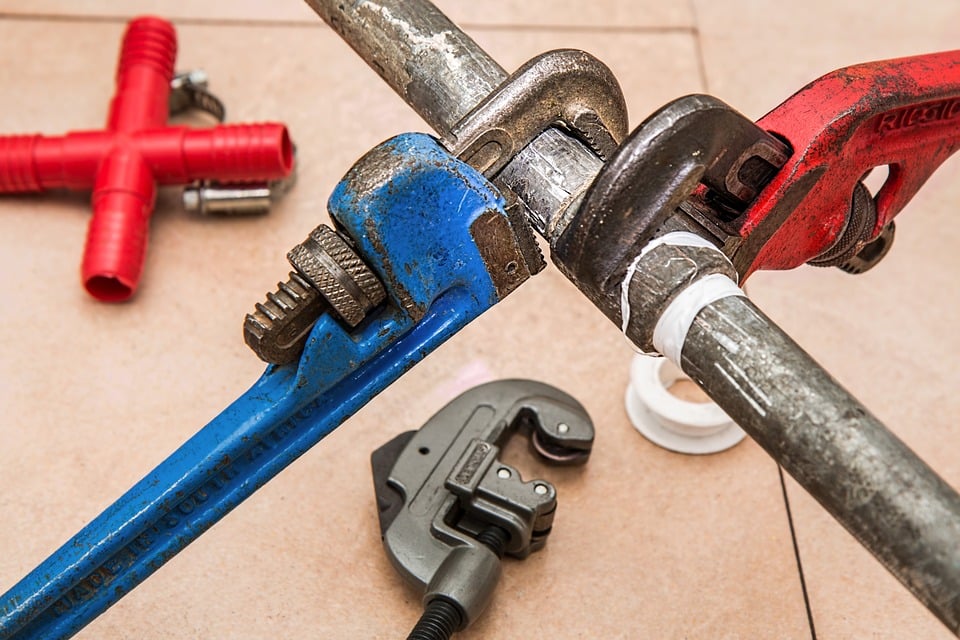 Pipe wrench and plumbing repair tools for professional plumbing maintenance