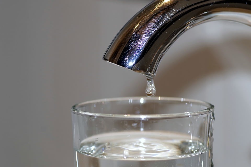 Clean running tap water from residential plumbing fixture