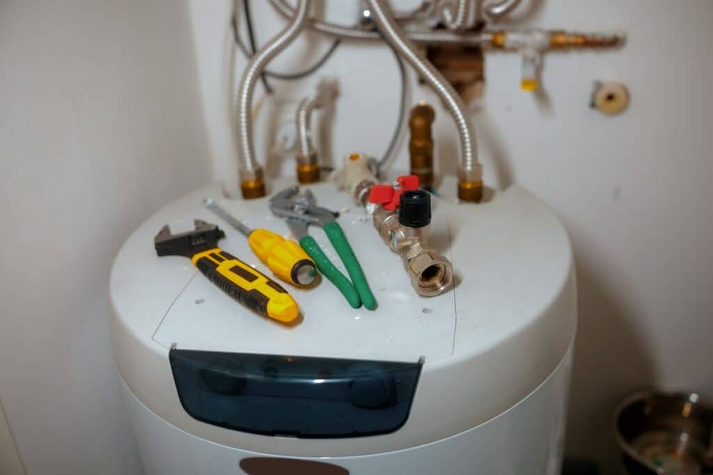 Residential water heater plumbing components and repair tools